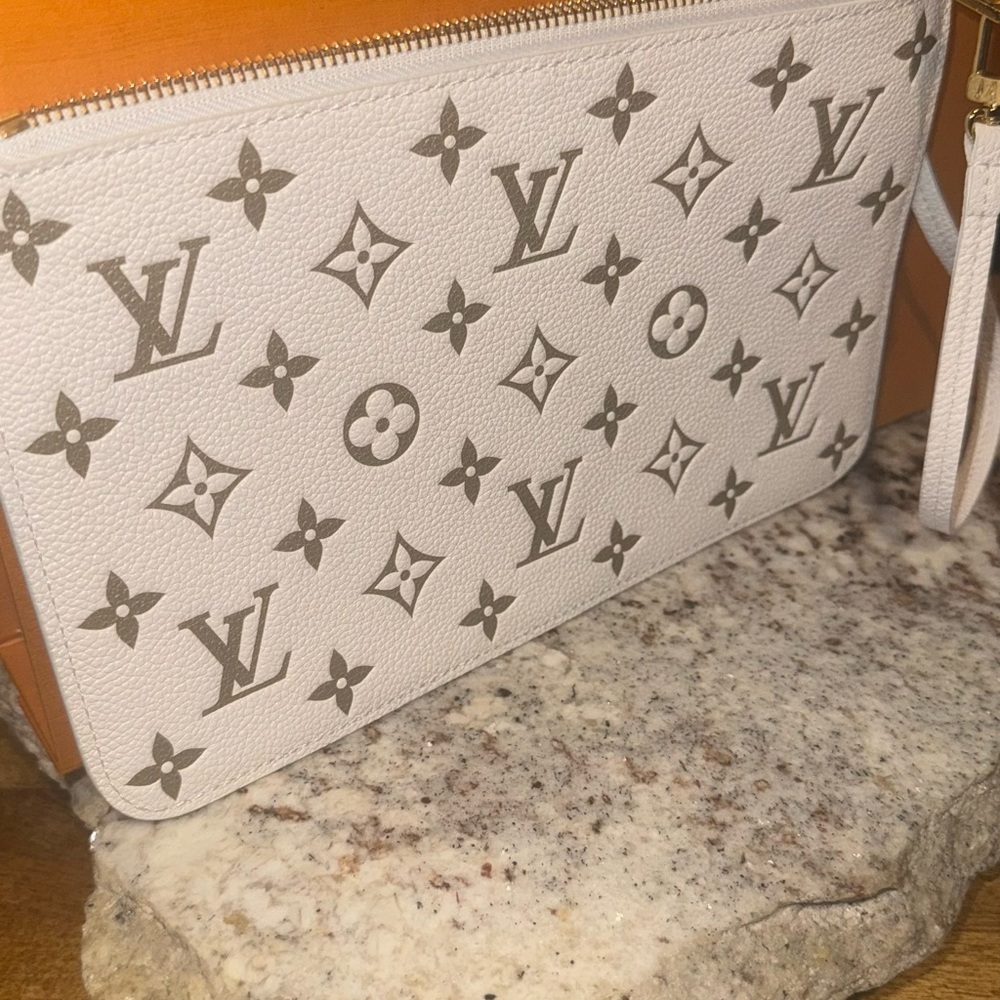 Louis Vuitton White and Gold Monogram Pouch 
Comes with Box and dust bag